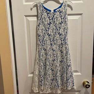 Like new juniors cream homecoming dress. Lace pattern and royal blue lining.